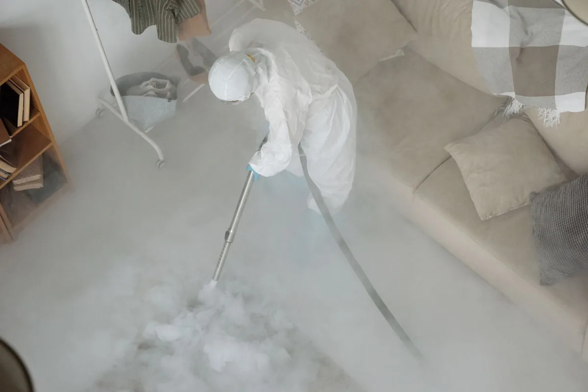 Biohazard cleanup technician in protective equipment, Tusculum, TN